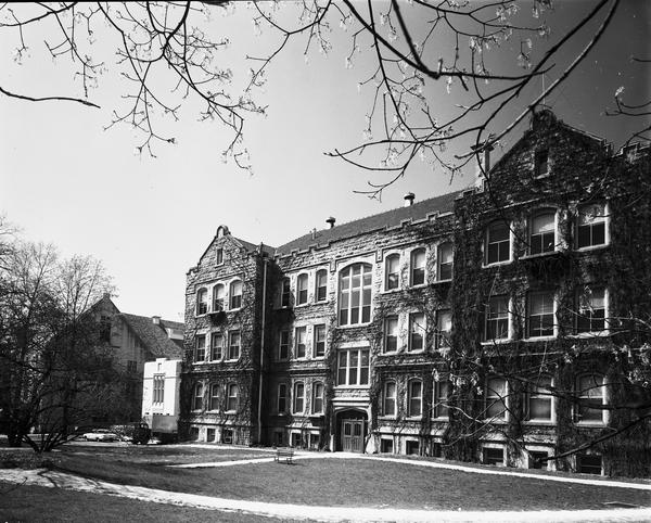 Front view of the ivy covered Swain East in black and white. 