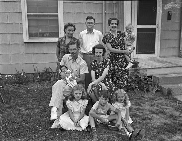 Photo of Family and Friends in front of house