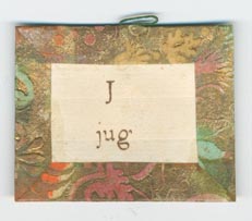Set 4. A and. Set of 26 unnumbered alphabet/word cards with thread hangers. Each bordered and backed with brown, orange, and green Dutch paper. 26 items.: Page 19 of 52