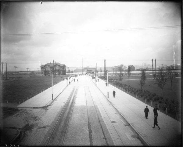 View Looking N. from Broadway Bridge of E.J. and E.Highline Showing Men Coming from Mill at Noon