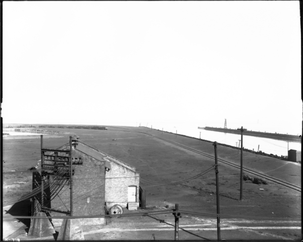 Harbor, Looking from End of Ore Yards, Toward Air Compressor House, Showing Lighthouse in Distance